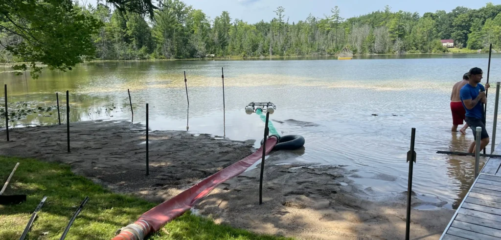 final steps of the beach sanding project on Cedar Lake in West Branch MI.