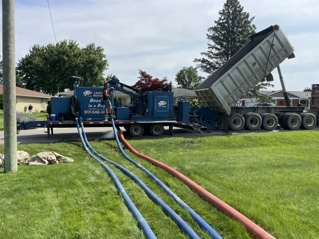 beginning the beach installation and sanding process. All hoses hooked up to water and Sand Pro!