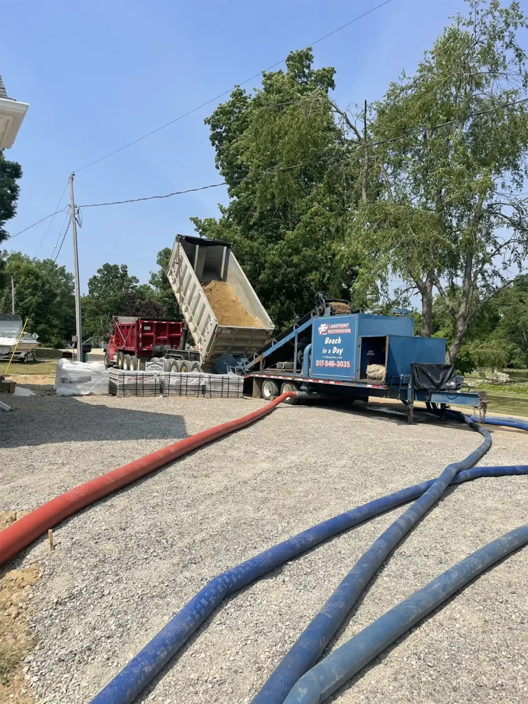 The Sand Pro System bringing water from the lake, mixing the sand, and pumping it back down to the beachfront for the new beach installation.